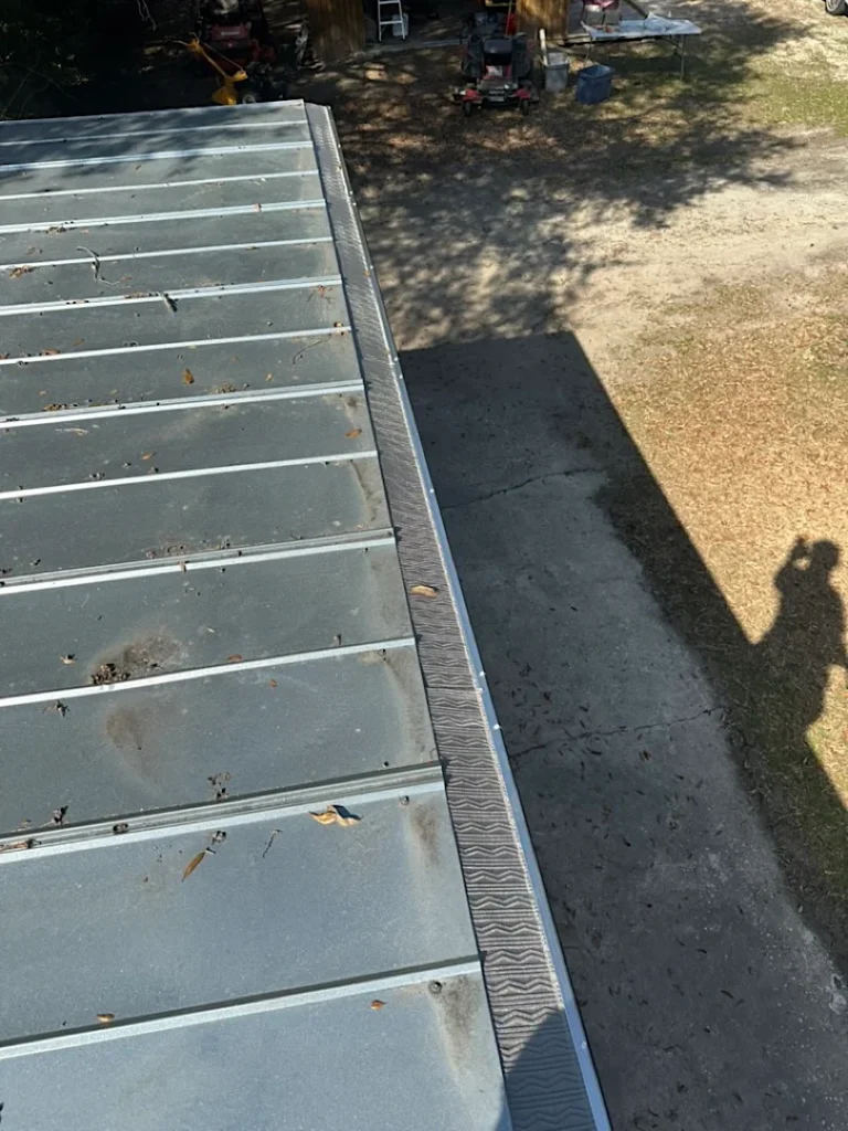 Metal roof gutters and stainless steel mesh guards in Ridgeville, SC.