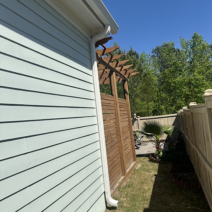 Summerville gutter installation in Nexton on light blue house