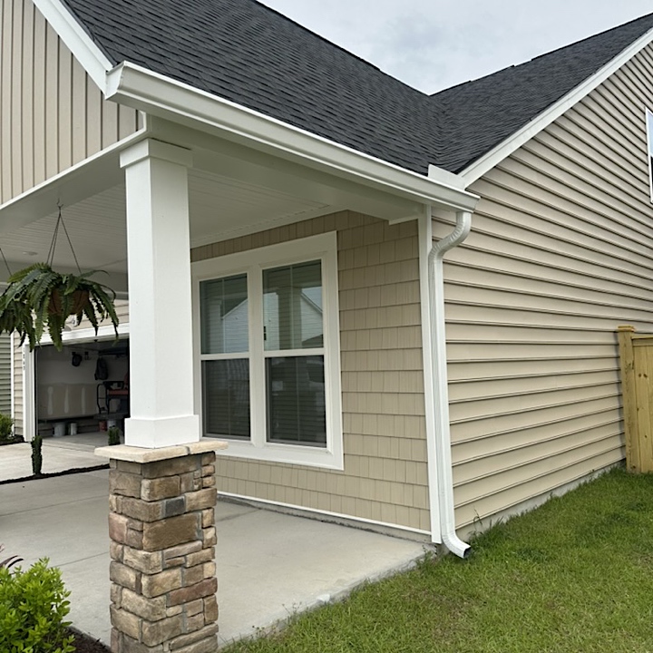 White K-style gutter installed on angled fascia.