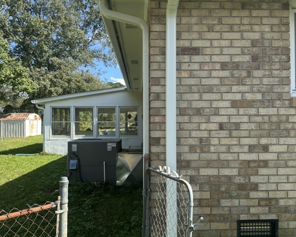 An illustration of a house showing how rain gutters direct water away from the foundation.