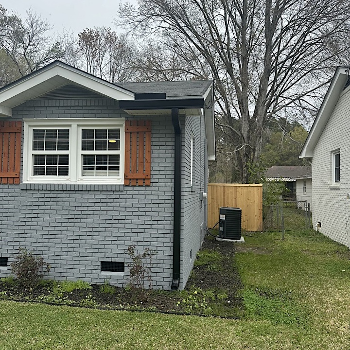 Gutter installation with black seamless gutters in Goose Creek SC
