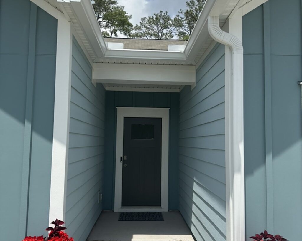 New gutter installation on a blue home in Ravenel SC