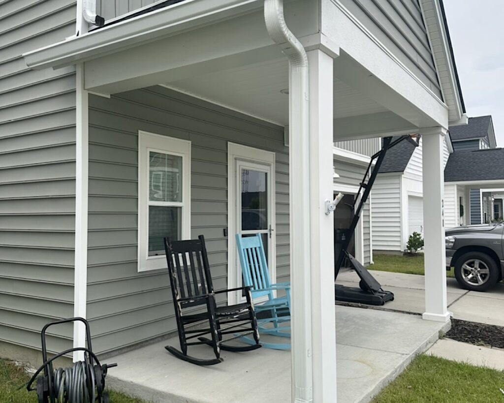 Downspout installed on front porch column in Summers Corner neighborhood